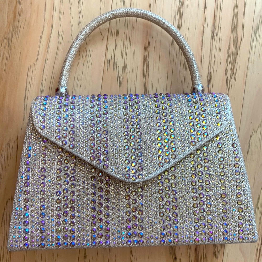 Like new small brown hand bag with iridescent jewel details.